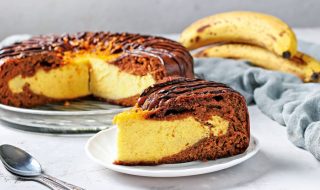 Homemade Chocolate Cake with cottage cheese and banana filling, with piece of cake cut off in the foreground